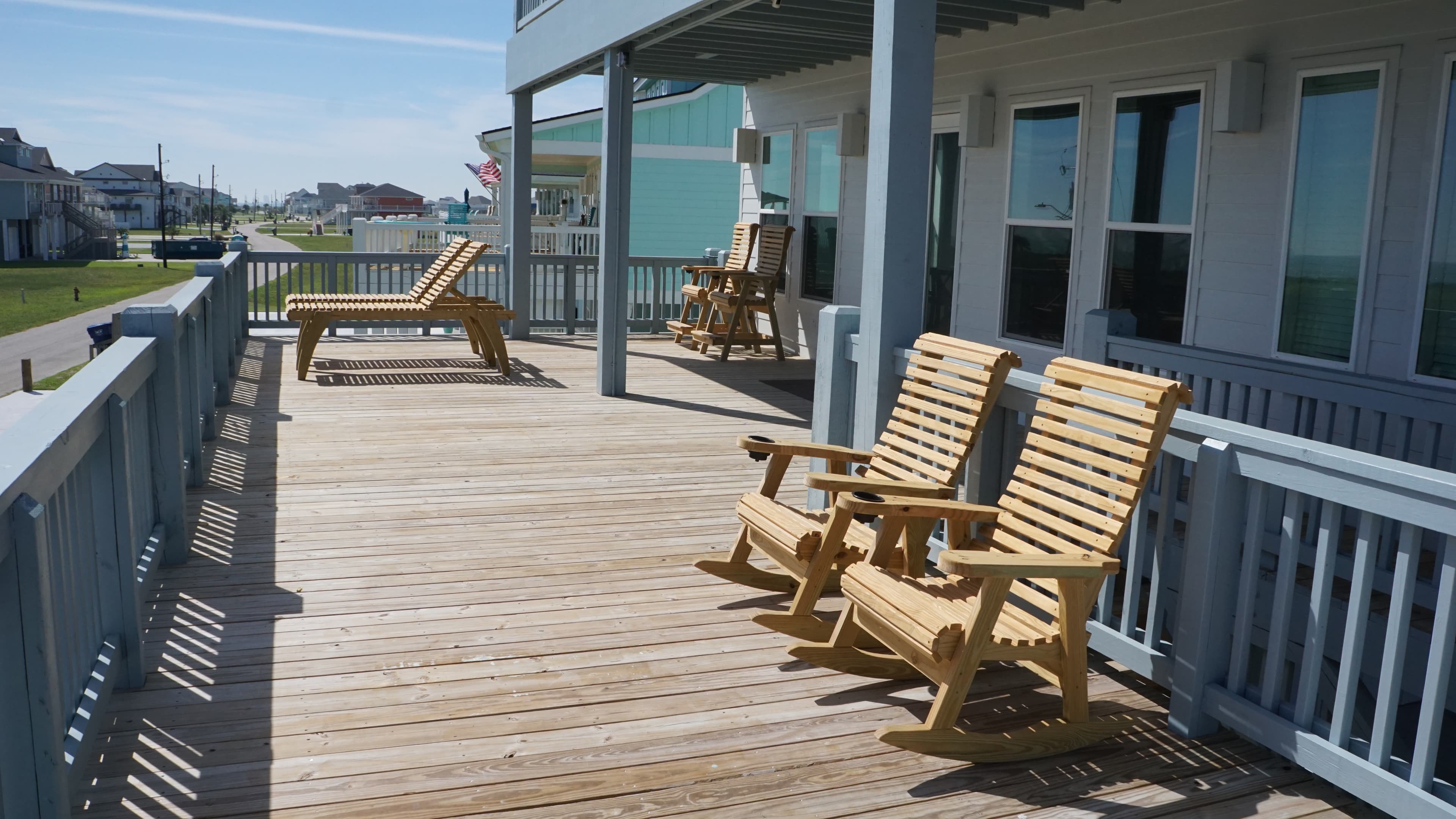 Full deck view with lounge chairs